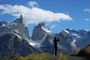 A photographer taking a shot of the Torres del paine mountainous landscape