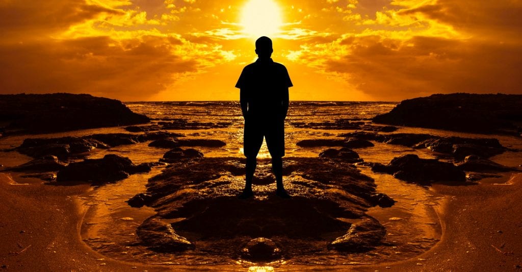 Silhouette of a man on beach at sunset visiting chile all year