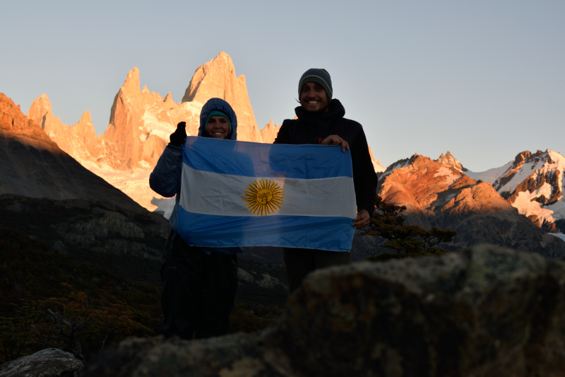 Condor Campers holding an argentina flag in el chalten