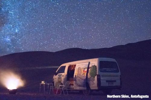 A Condor Camper Campervan under clear northern chile skies. Lots of stars and a glowing bbq in the front