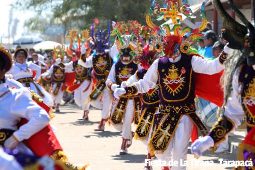 La Tirana festival in Tarapaca,Chile. Dancers in bright colours. All decorative, wearing masks.